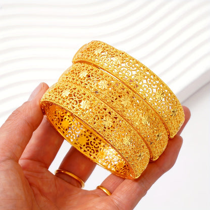 Two pieces of beautiful Golden Open Bracelet with Elegant Hollow Design, perfect for Middle Eastern and Saudi Arabian Festivals. An exquisite gift for women's fashion, ideal for Dubai brides. This hand ornament showcases European and American Ethnic