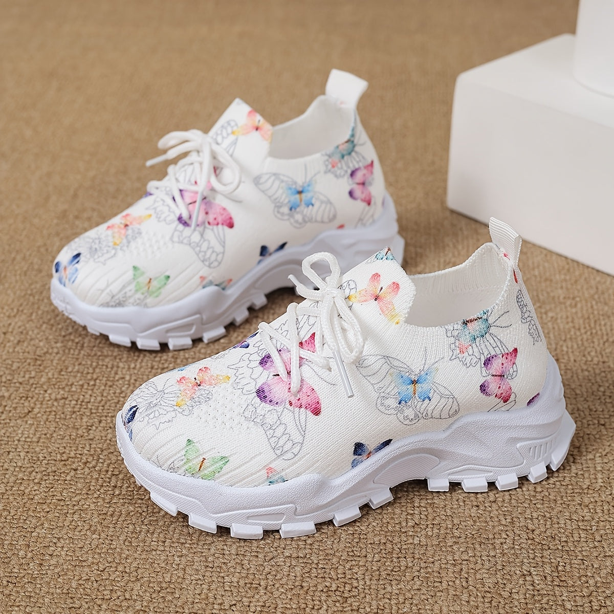 Stylish butterfly patterned running shoes for kids, with comfortable non-slip soles for outdoor sports.