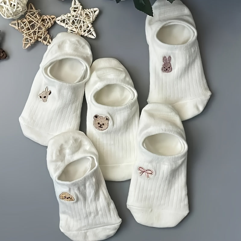 10 pairs of adorable white ankle socks with embroidered patterns, perfect for everyday wear.