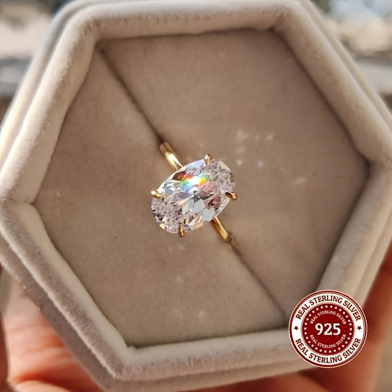 Luxurious minimalist ring made with 925 sterling silver featuring an oval cut synthetic zirconia in a claw setting. Available in 1CT, 2CT, or 3CT options for both weddings and daily wear. Weighing 2.5g, this ring is adorned with a simulated diamond for a