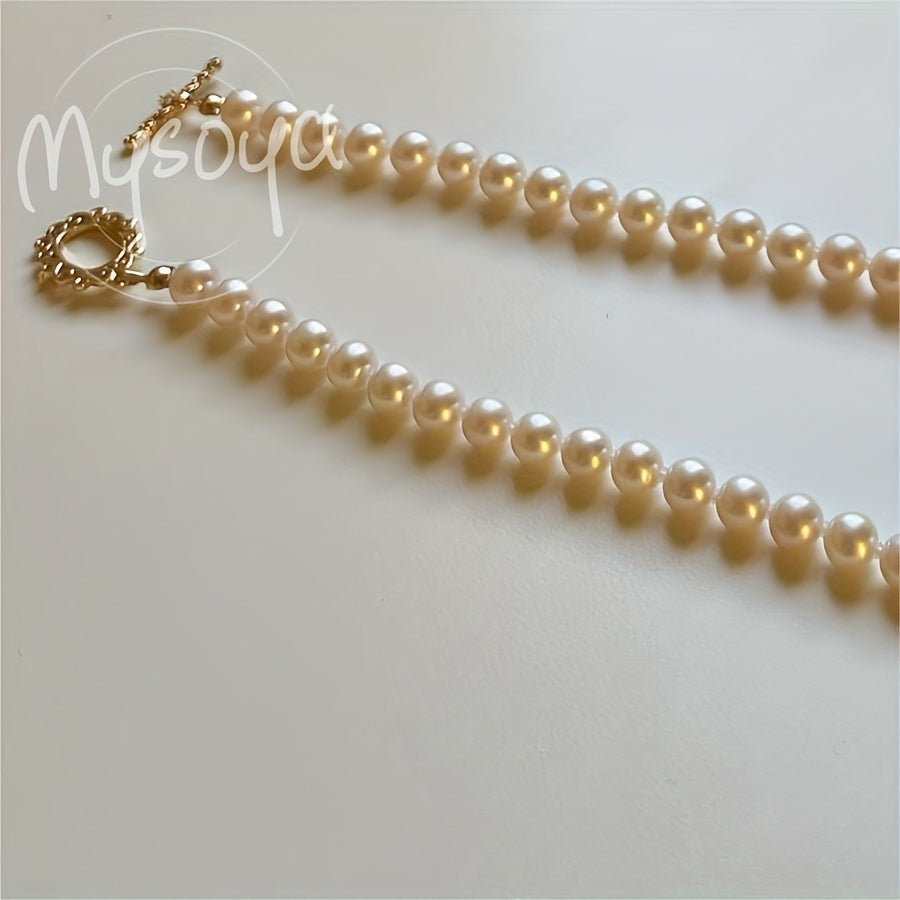 Enhance your look with the MYSOYA Elegant Handmade Freshwater Pearl Necklace. Featuring 5-6mm white pearls with a vintage OT clasp, this exquisite piece is perfect for weddings and daily wear. Presented in a chic gift box, it makes an ideal gift for