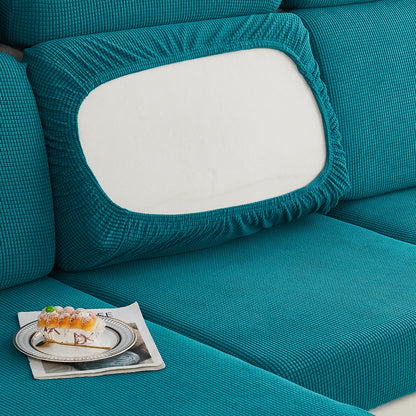 Durable sofa cover protects furniture from spills and stains.