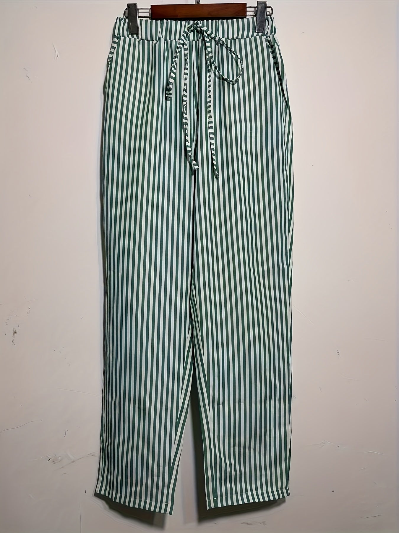 High-waisted, striped wide-leg pants for women made of lightweight polyester. Machine washable with side stripe detail for all-season comfort.