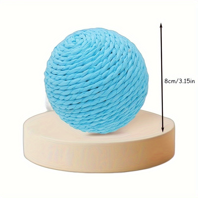 Interactive sound-making cat scratching ball toy made of cardboard material for cats to relieve play with their pet companion.