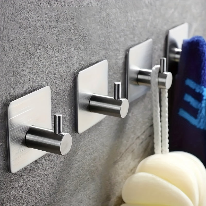 Contemporary self-adhesive stainless steel hook for towels, robes, coats, and other items in the bathroom or kitchen, with a waterproof design for easy shower wall mounting.