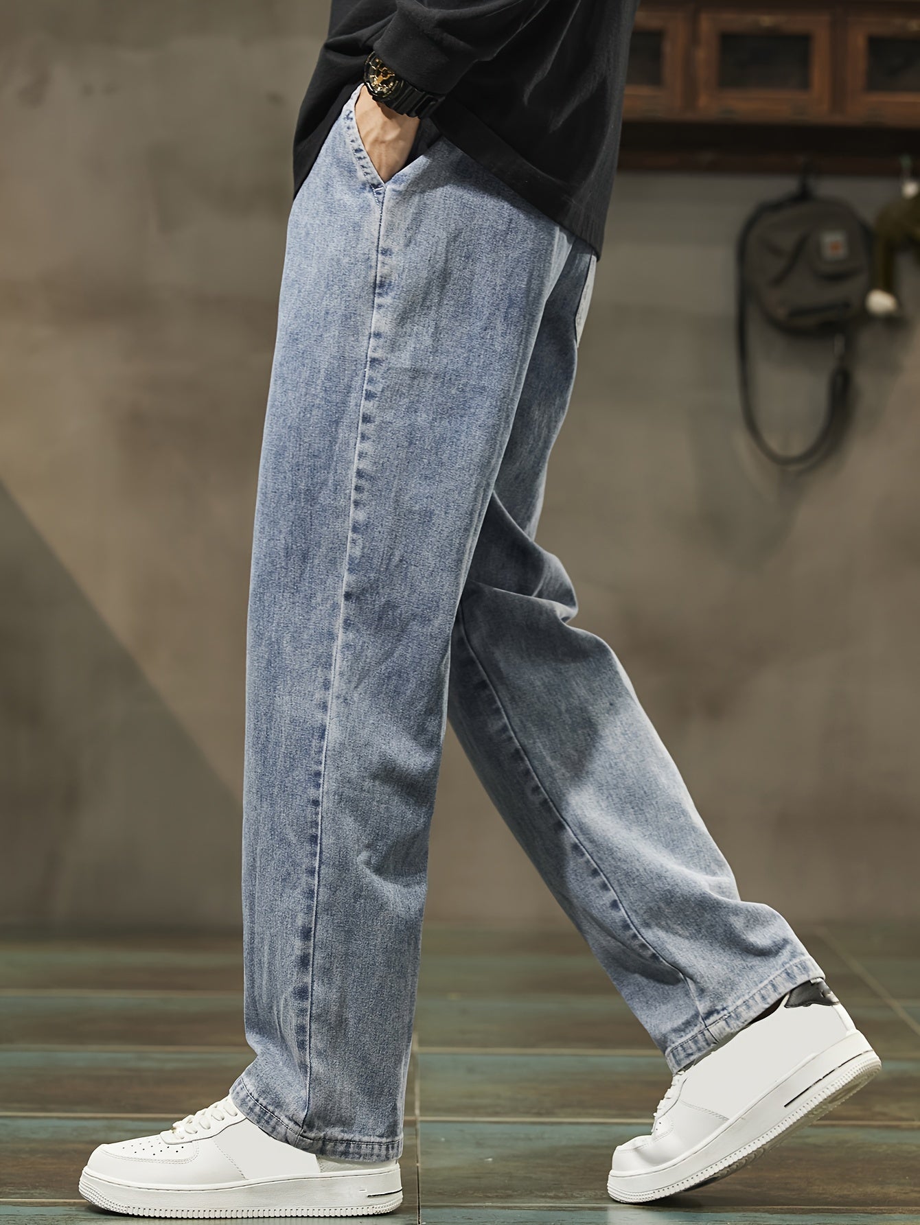 Men's denim pants with pockets, drawstring waist, suitable for outdoor activities.