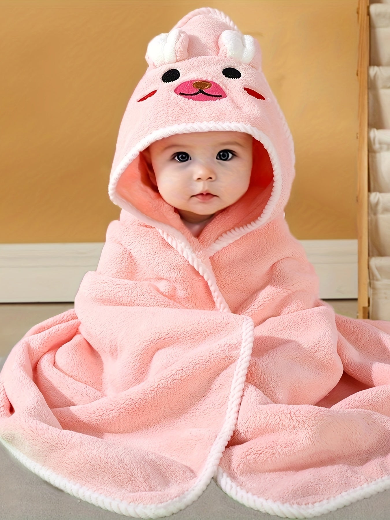 Multi-functional and highly absorbent hooded bathrobe with animal pattern for babies, ideal for swimming, beach, or bathing.