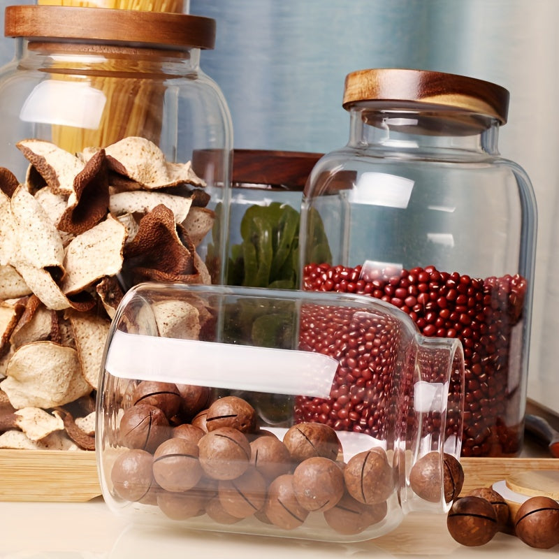 Large glass food storage jars with airtight wooden lids for storing coffee beans, dried food, pasta, tea leaves, overnight oats, grains, and spices. These clear glass canisters are perfect for organizing your kitchen and keeping your ingredients fresh.