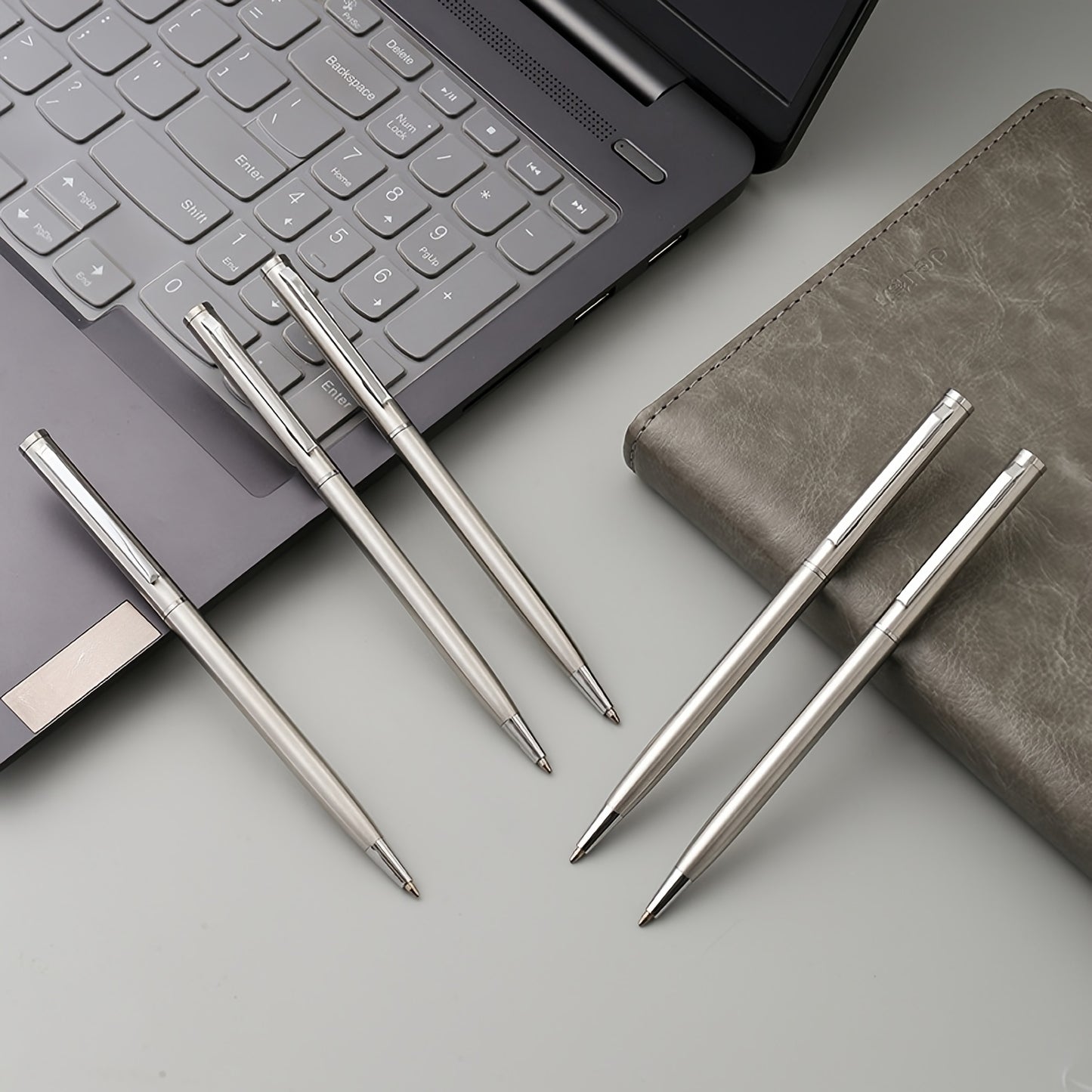 5 elegant silvery stainless steel ballpoint pens with durable medium points, twist action, and smooth writing for adults 14+. Ideal for office use and gifting.