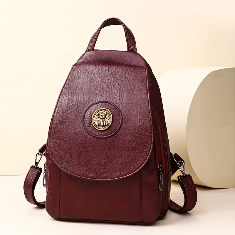 Women's retro-style synthetic leather backpack with adjustable straps, multiple compartments, magnetic closure, and denim design in brown, beige, or black for daily or work use.