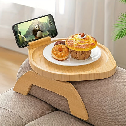 Non-slip sofa tray with phone holder and foldable armrest table, ideal for wide sofas and includes a drink holder shelf. Made of wood.