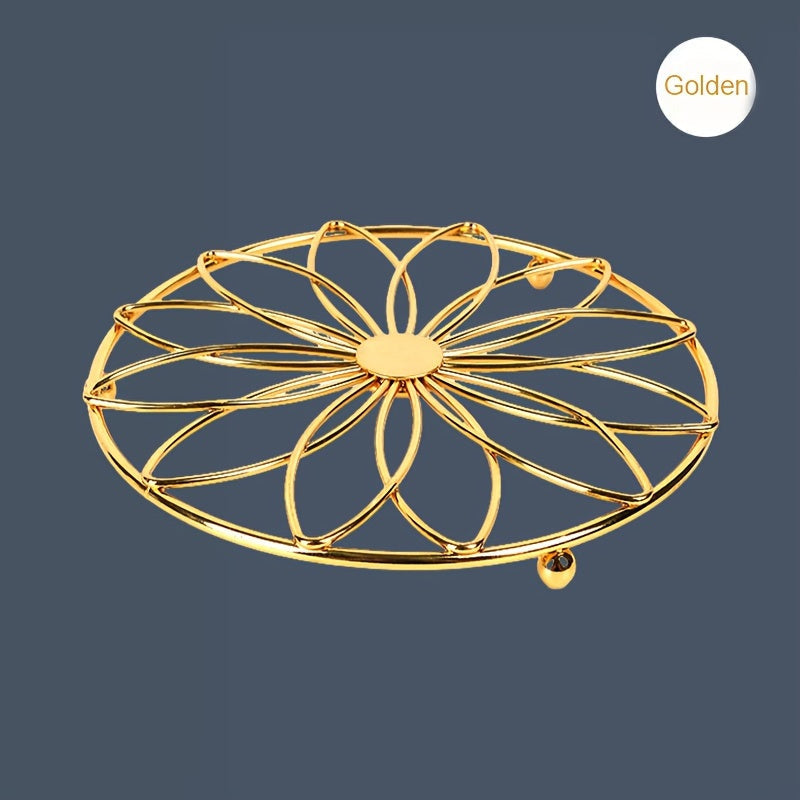 This stylish trivet features a decorative hollow flower design and is made of durable stainless steel. It is heat-resistant and non-slip, making it the perfect accessory for your dining and kitchen countertops. Ideal for Halloween and Christmas parties