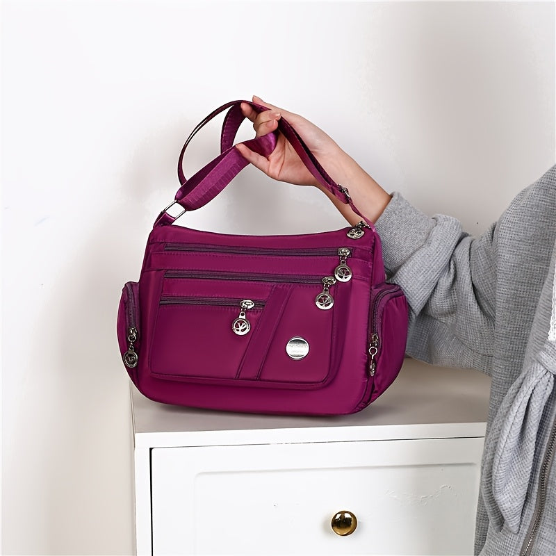 Women's versatile crossbody bag with adjustable strap, multiple compartments, zipper closure, and polyester lining for shopping, office, and travel, available in multiple colors.