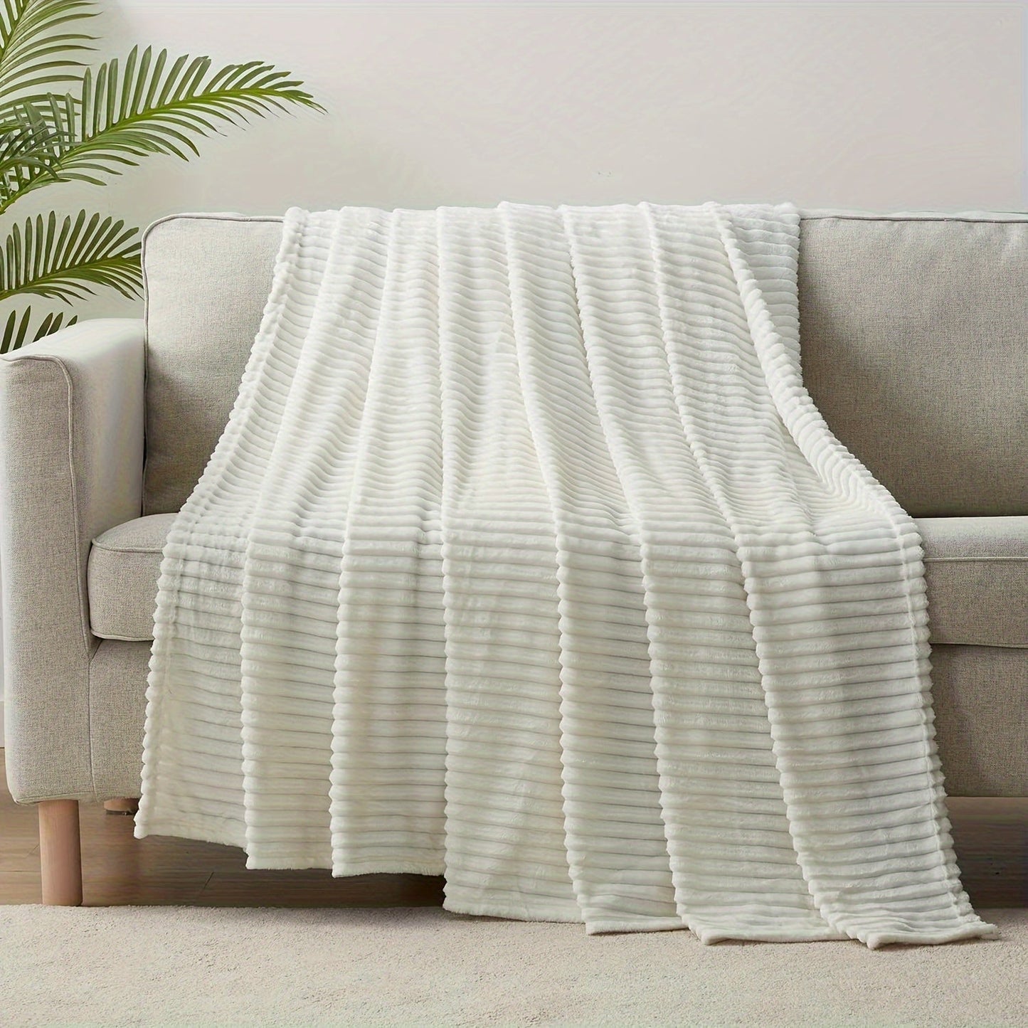 Stay cozy and warm with our Ultra-Soft Oversized Fleece Throw Blanket. Made with lightweight and warm 280GSM microfiber, this blanket features a 3D ribbed Jacquard design for added style. Hypoallergenic and perfect for all seasons, this blanket is a