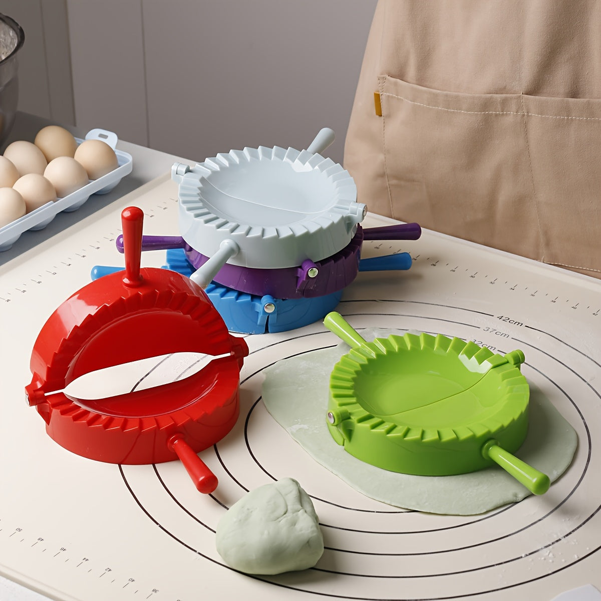 One piece of a plastic dumpling maker, also known as a dumpling mold or manual dumpling wrapper. This versatile kitchen gadget can also be used as an empanada maker and comes with kitchen accessories.