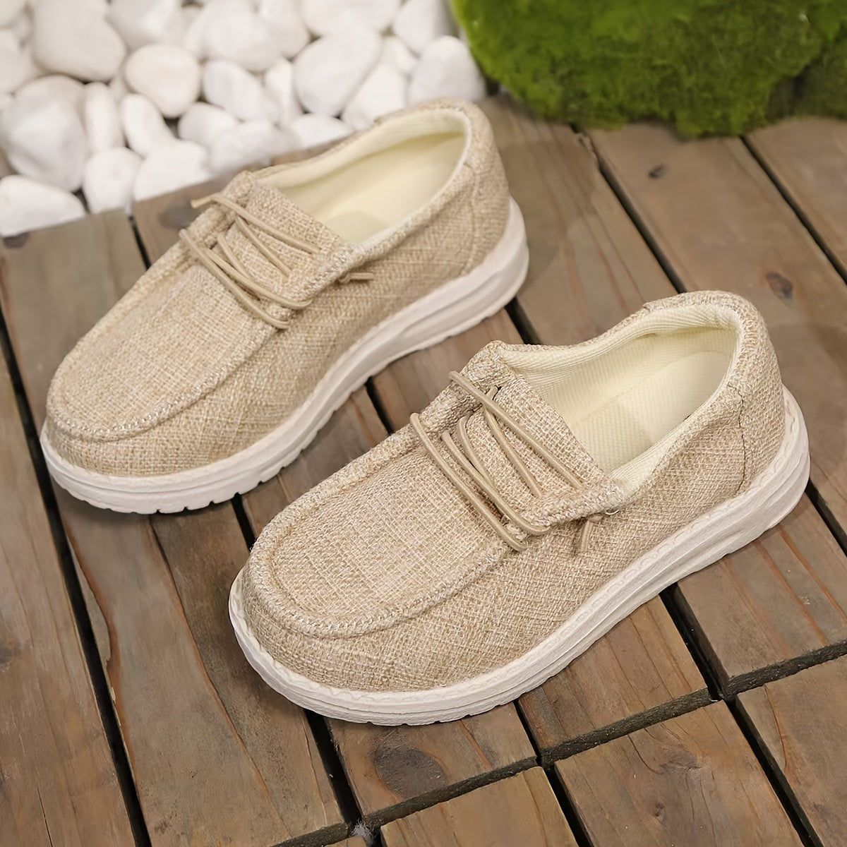 Breathable slip-on canvas sneakers with soft EVA sole and decorative stitching in gray fabric, ideal for all seasons and casual attire.