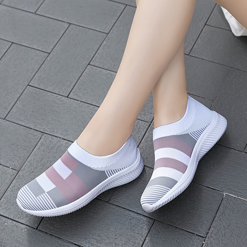 Breathable mesh slip-on sneakers for plus size women in pink, gray, and white plaid with soft sole and round toe design, suitable for all seasons.