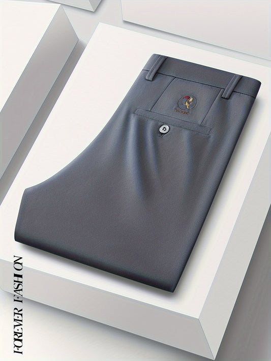 Stretchy black dress pants with bird emblem for men, slim fit, machine washable for business casual and social events.