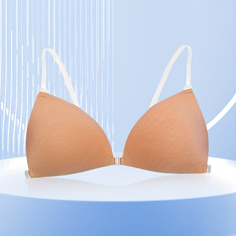 Reusabe beige self-adhesive bra with removable straps for a natural look. Comfortable and seamless in polyester silicone material. Invisible and elegant lingerie accessory.