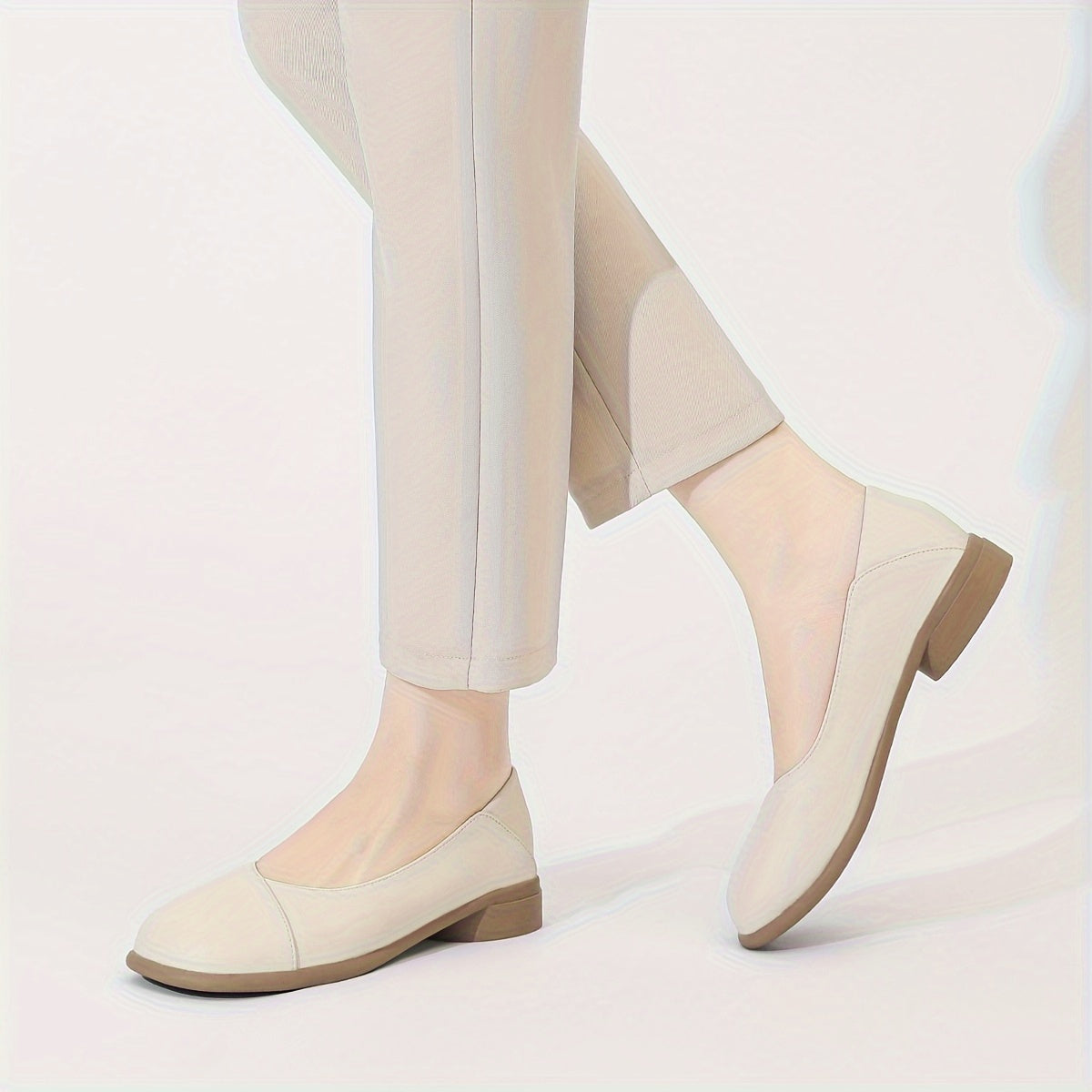 Stylish white low heel flats with all-day comfort for work.