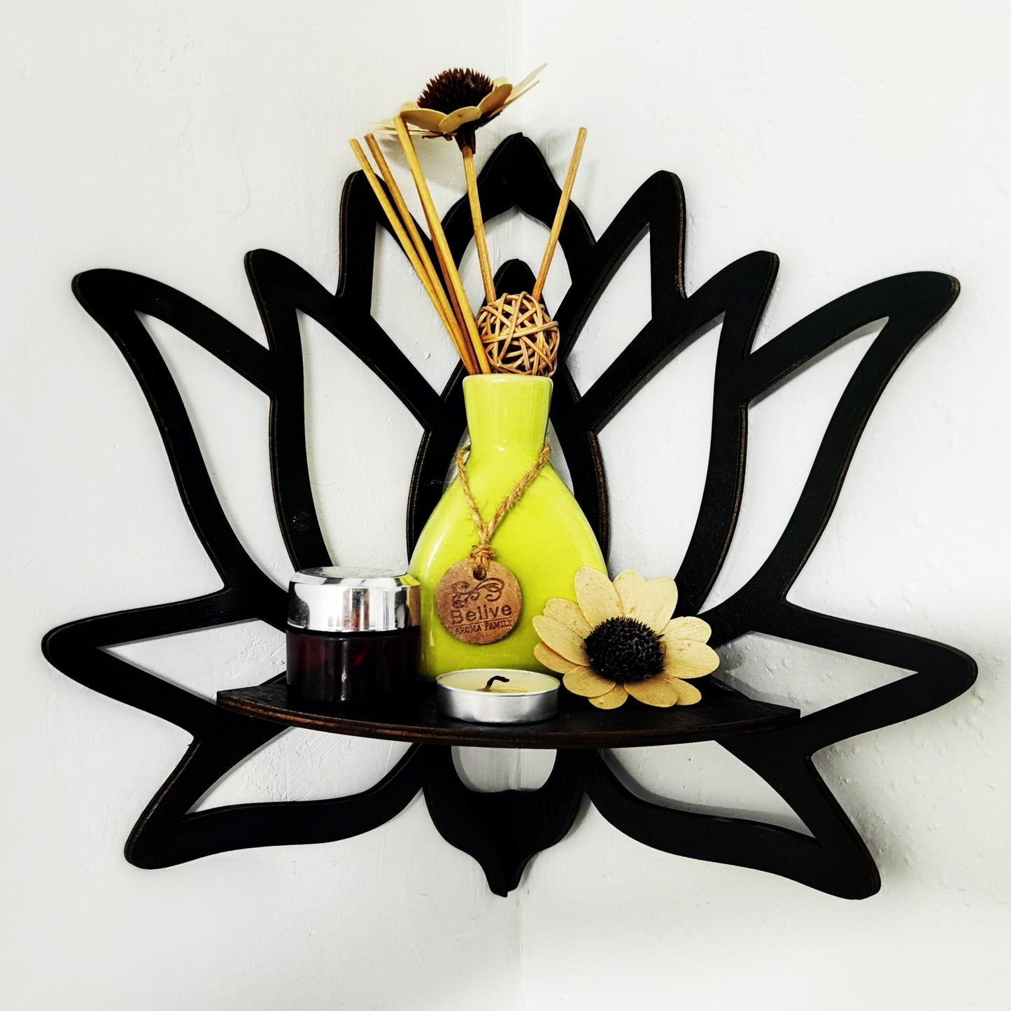 Black wooden wall shelf in the shape of a lotus and butterfly, ideal for displaying candles. Made of manufactured wood, suitable for festive wall decor.