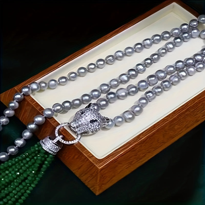 A classic Y-necklace featuring freshwater pearls and a stylish leopard clasp - perfect for adding a touch of elegance to any outfit. This versatile piece is great for weddings, banquets, music festivals, vacations, and the autumn season. It also makes a