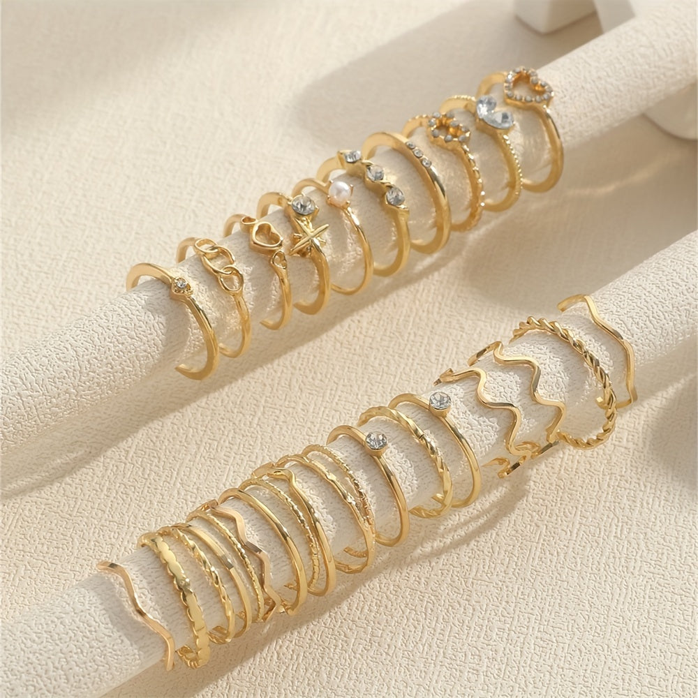 A 28-piece set of stylish alloy iron stacking rings with heart, geometric, and wavy designs for versatile wear.