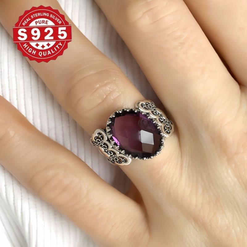 Handmade with care, this stunning cocktail ring features a detailed filigree art heart design and is crafted from 925 sterling silver. Adorned with a beautiful amethyst gemstone, this solid silver ring is perfect for everyday wear.