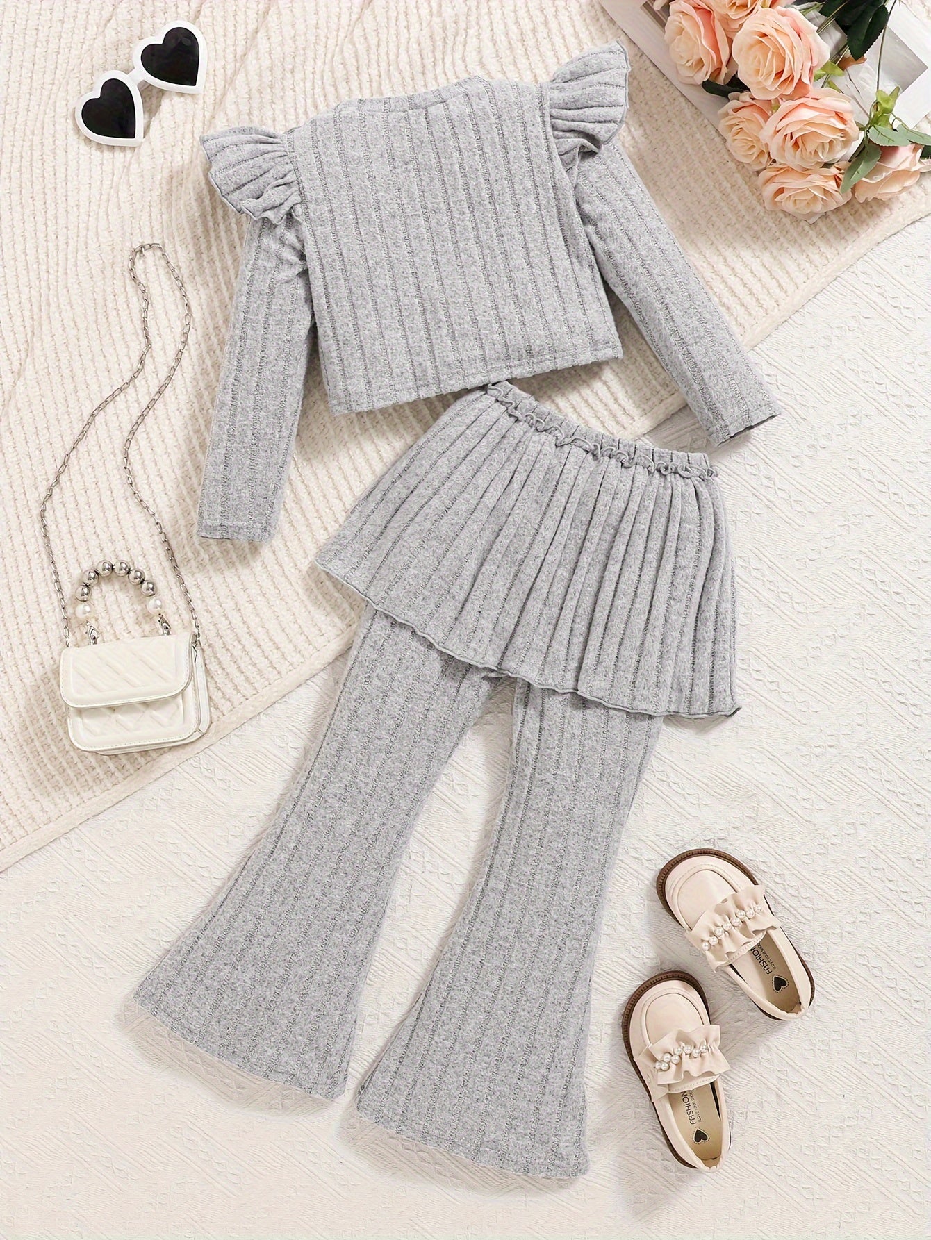 Elegant solid color ribbed bow top with flying sleeves for girls aged 3-10, paired with a Western style two-piece set including bell-bottom pants.