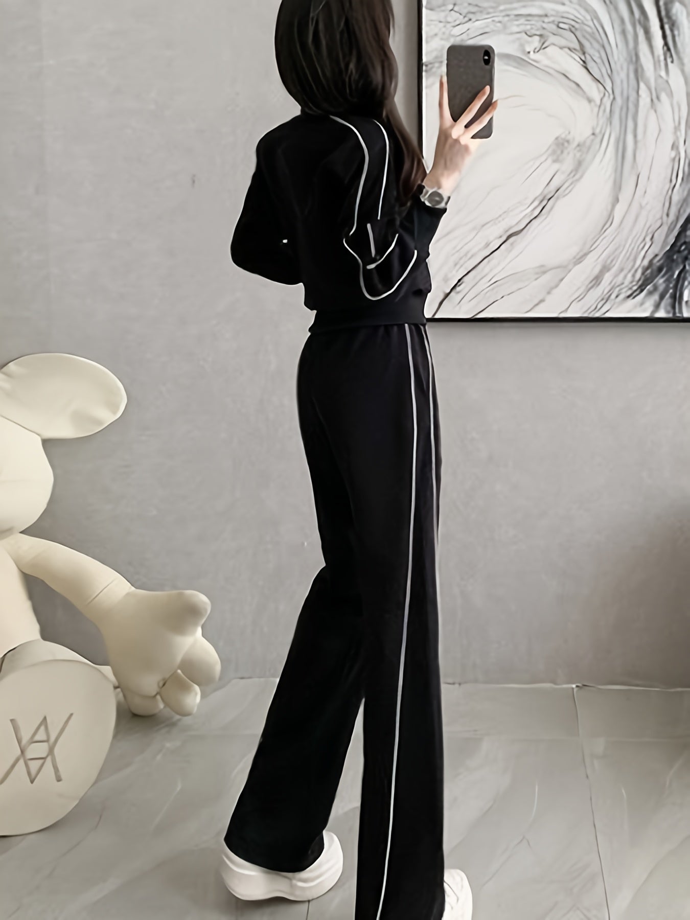 Women's zip-up cardigan and high-waist wide-leg pants set in black, perfect for casual wear. Made from a polyester blend with long sleeves, solid color, and a high-grade European and