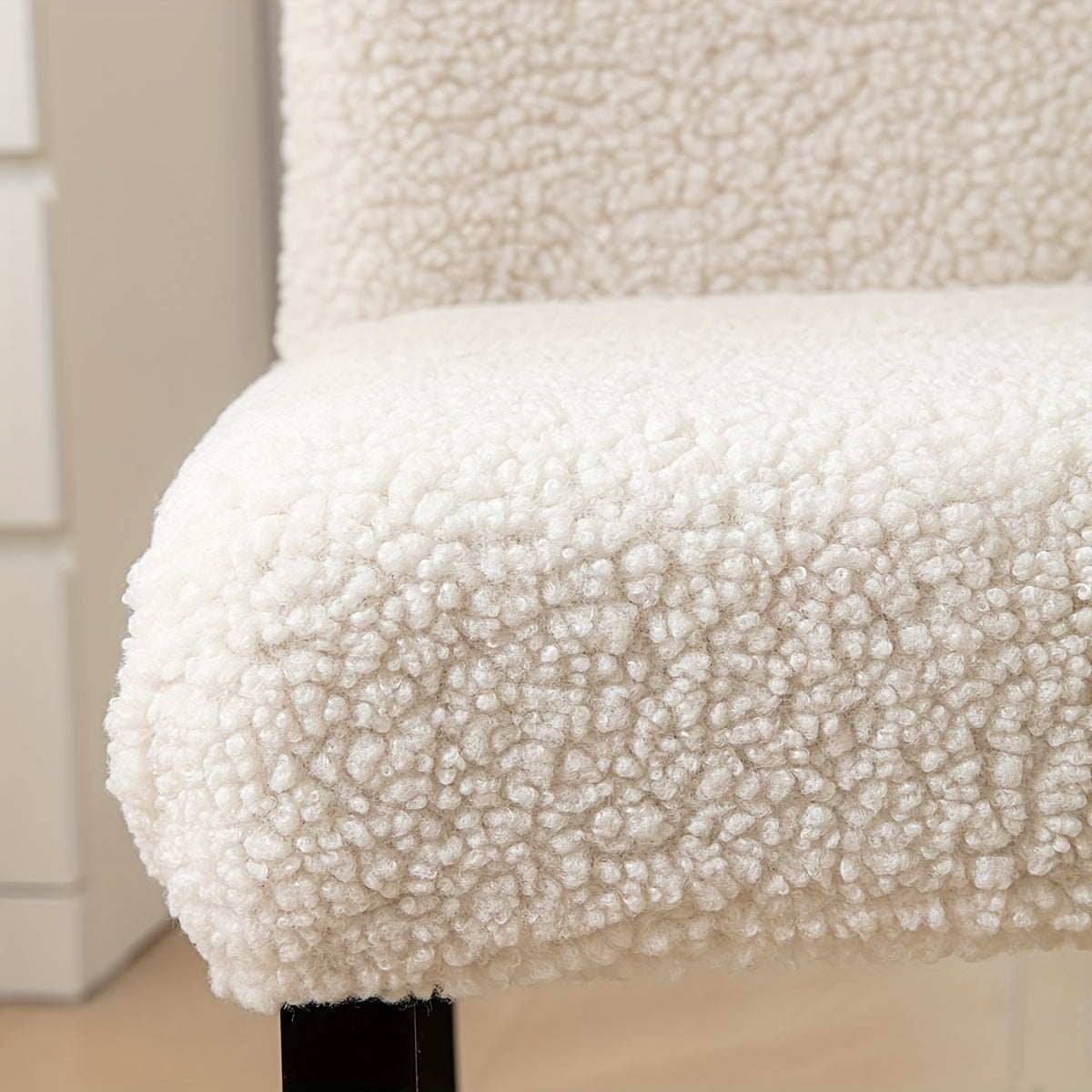 Stretch Sherpa chair cover with removable elastic slipcover, pet-friendly and machine washable. Made with a polyester and spandex blend, designed for home, restaurant, office, or banquet use. Available in multiple colors.