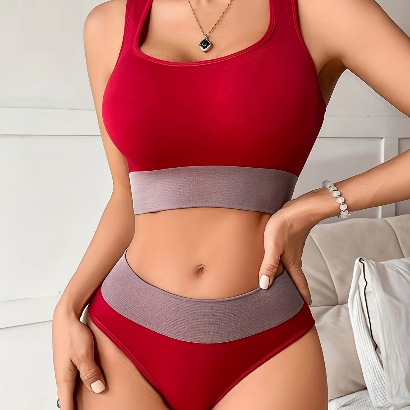 Colorblock seamless sports bra and panty set for women made of high support nylon-elastane blend that is non-see-through.