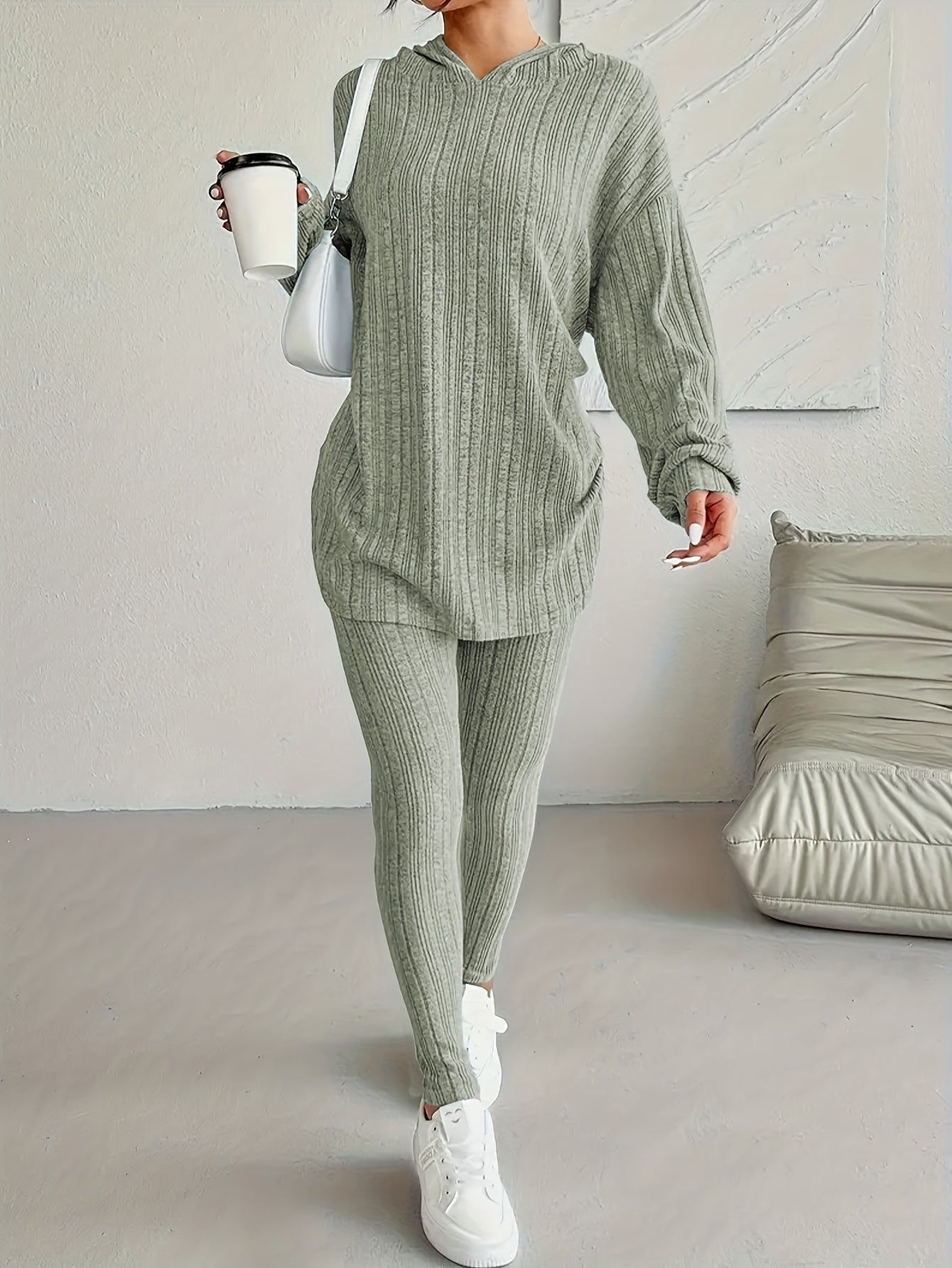 Women's cozy ribbed fleece lounge set featuring a long sleeve hoodie and stretchy leggings ideal for casual home wear in the fall/winter. Made of a comfortable polyester blend with a