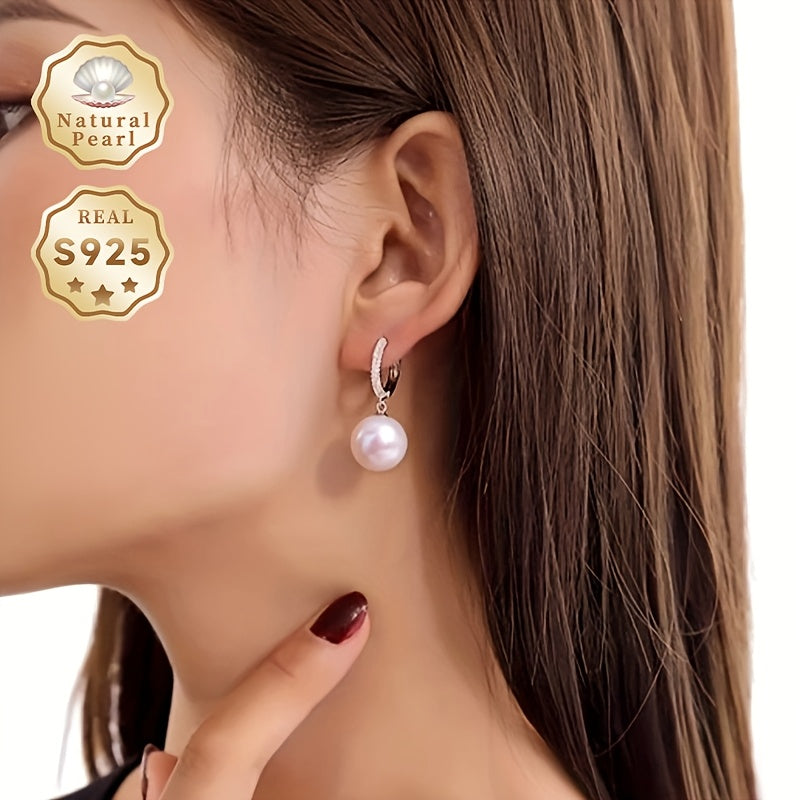 Get ready to dazzle with the luxurious elegance of these Daimi Hoop Earrings, made with 925 Sterling Silver and adorned with a natural Freshwater Pearl, the perfect June Birthstone gift for any occasion