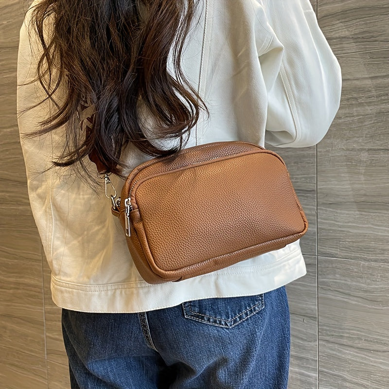 Women's stylish crossbody bag in deep brown, cream white, or black. Features zipper closure and polyester lining.