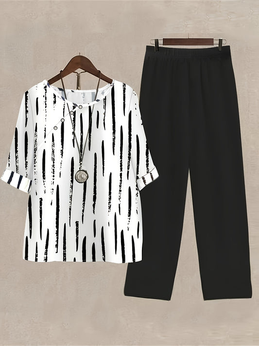 Women's Brush Print Cozy Leisure Set, including a short sleeve blouse with rolled hem and straight leg solid color pants.