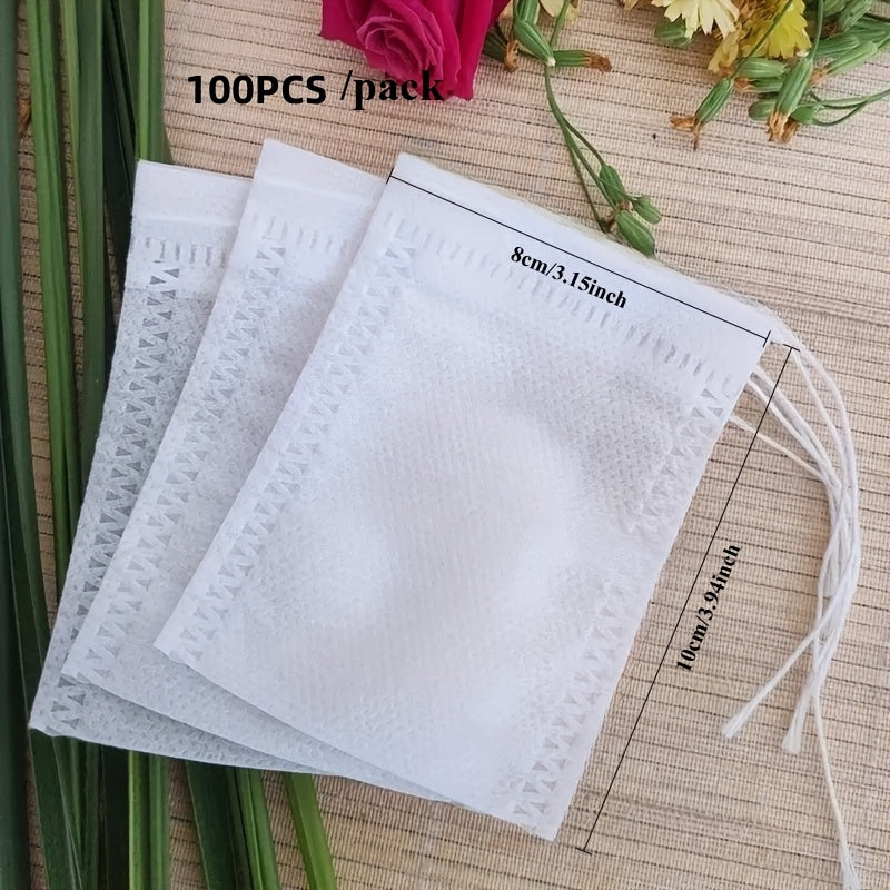 A bundle of 100 tea bags made from nonwoven material, complete with drawstrings, perfect for loose leaf tea, herbs, and spices. Comes in various sizes (6cm x 8cm, 7cm x 9cm, 8cm x 10cm).