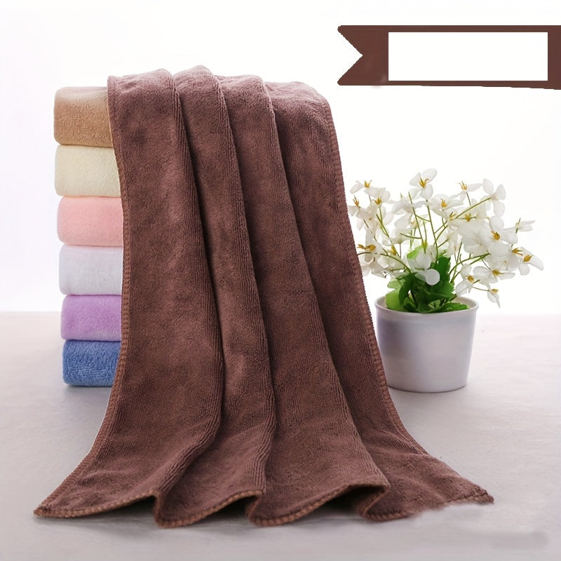 Soft microfiber bath towel with quick dry and absorbent features for use at home or in the spa, featuring a modern cloud pattern design.