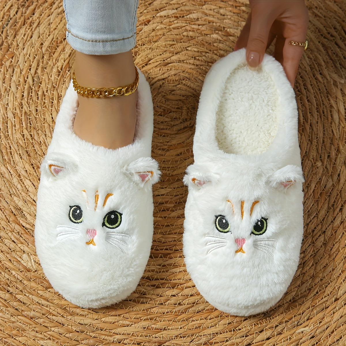 Cozy cartoon cat eyes winter plush slippers with soft sole, fluffy material, and hand washable. Perfect for cold weather and comfort. Ideal for indoor use.