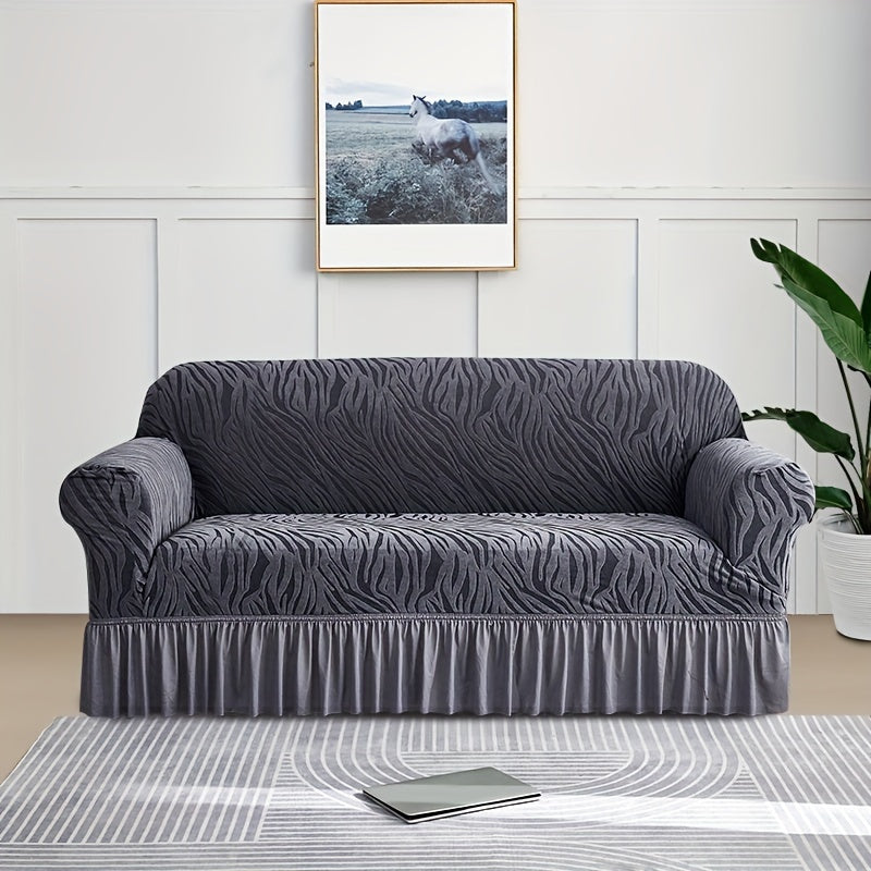 Wave pattern sofa slipcover with skirt, non-slip and dustproof. Protects furniture from cat scratches. Machine washable for easy cleaning. Suitable for bedroom, office, or living room décor.