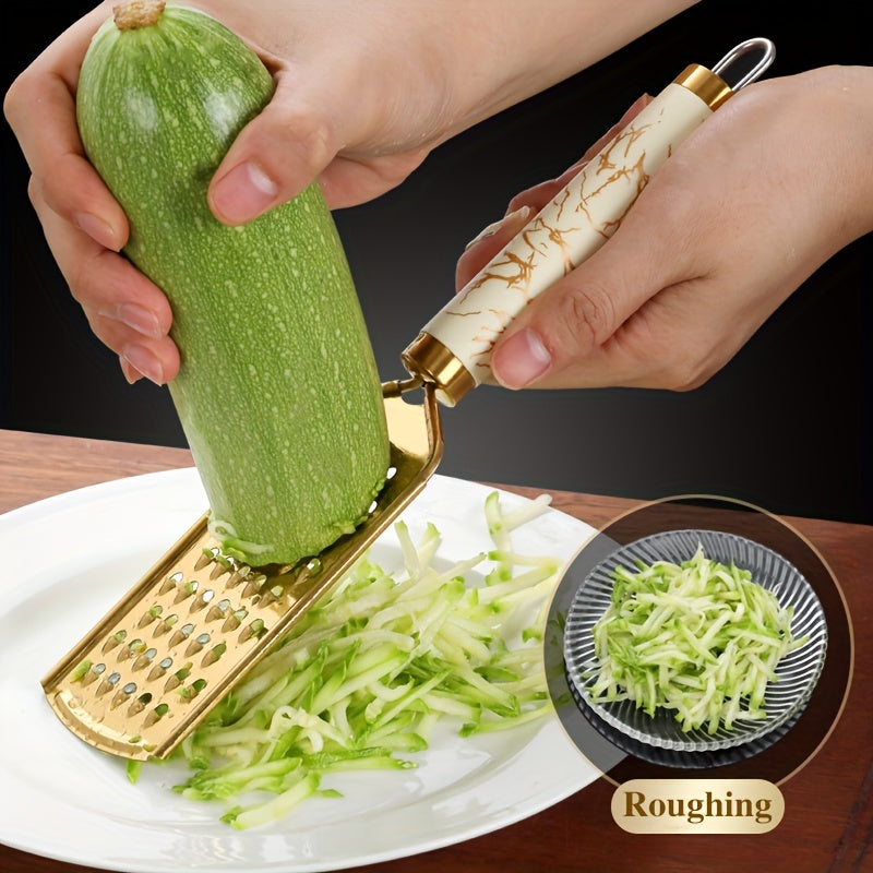 Stainless steel kitchen grater for shredding various foods, with a safe handle and luxurious golden appearance.