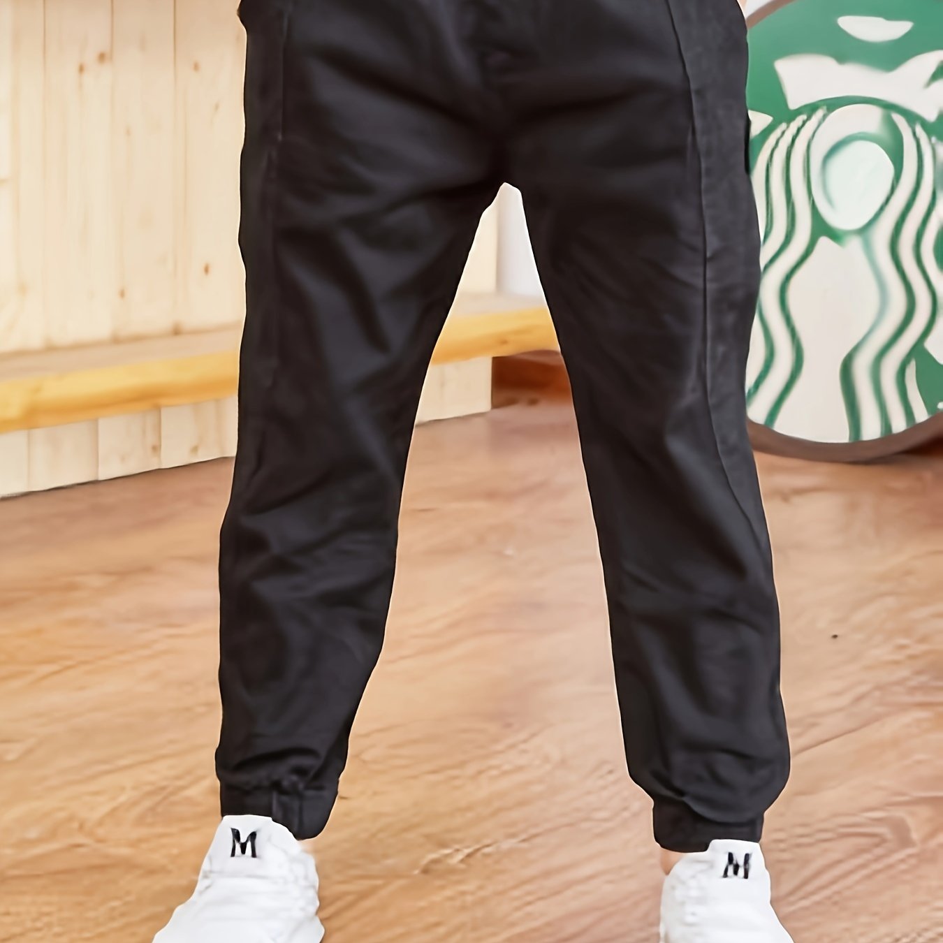 Boys' slim fit khaki cargo pants made with a durable cotton blend, featuring an elastic waist and pockets. Ideal for hiking, sports, and everyday wear.