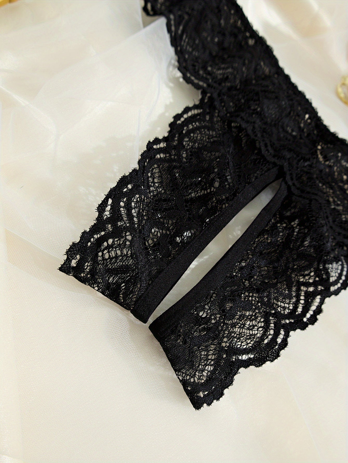 Sexy black lace panties with open crotch, low-rise design, perfect for Valentine’s Day.