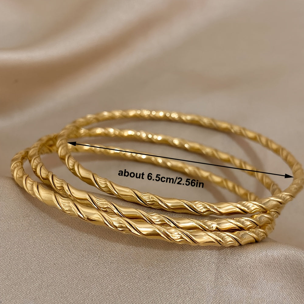 Set of 3 Golden Twist Stainless Steel Bangles, featuring a Chic Classic Tibetan Buddha design. Can be stacked for a stylish look, perfect for both women and men.