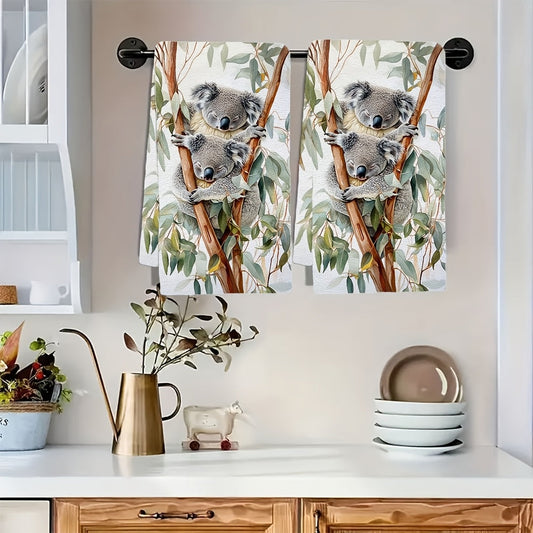 Two ultra-soft kitchen towels featuring a delightful koala and eucalyptus watercolor design. These towels are highly absorbent, machine washable, and perfect for adding a contemporary coastal touch to your decor. Size: 40.64x60.96 cm.