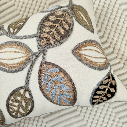 Leaf embroidered canvas throw pillow cover with zipper, machine washable, for modern living room and bedroom decor.