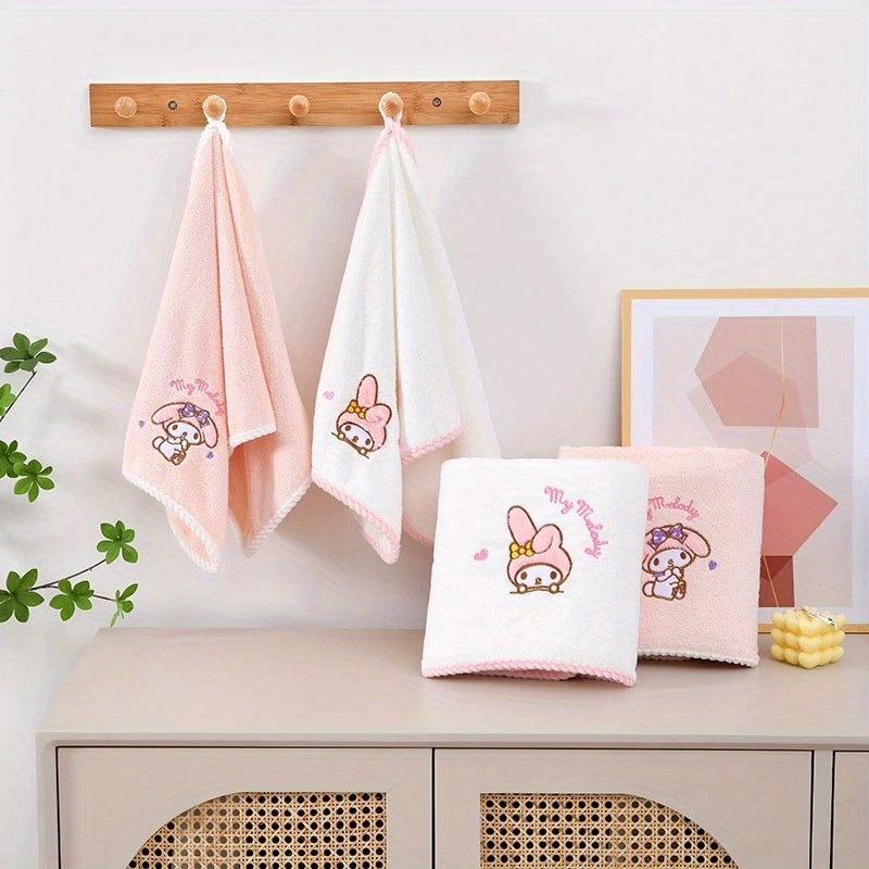 Contemporary cartoon-themed Hello Kitty and Friends plush bath towels in knit fabric made from a 40% cotton, 60% acrylic blend. Featuring a checkered pattern, low lint, 280gsm, and oblong shape, ideal for wash cloths.