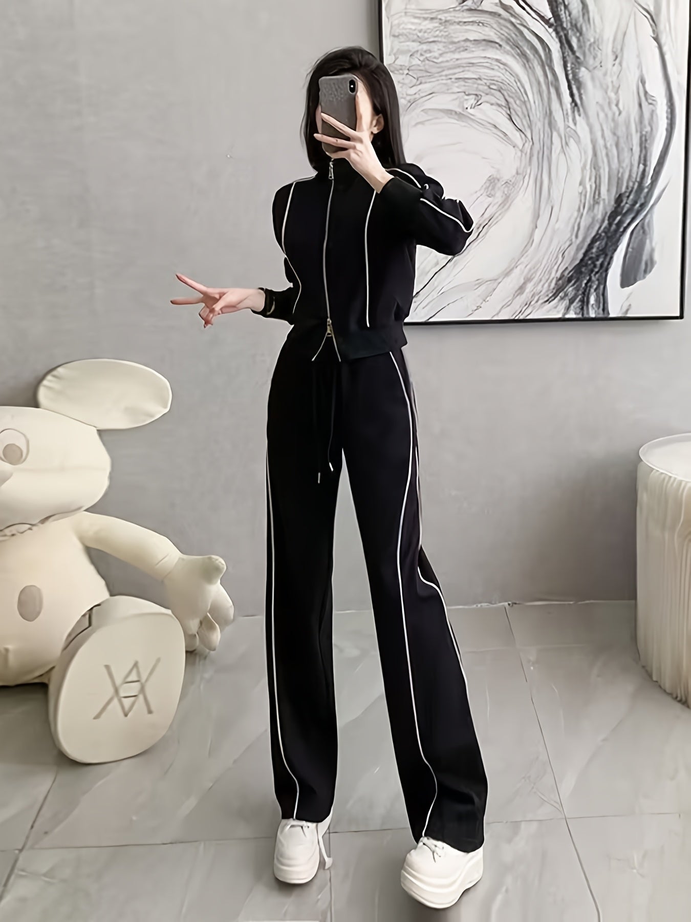 Women's zip-up cardigan and high-waist wide-leg pants set in black, perfect for casual wear. Made from a polyester blend with long sleeves, solid color, and a high-grade European and