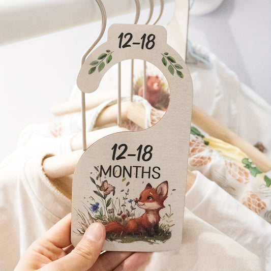 8 wooden closet dividers featuring cute animal themes for organizing clothes in a wardrobe for 24 months.