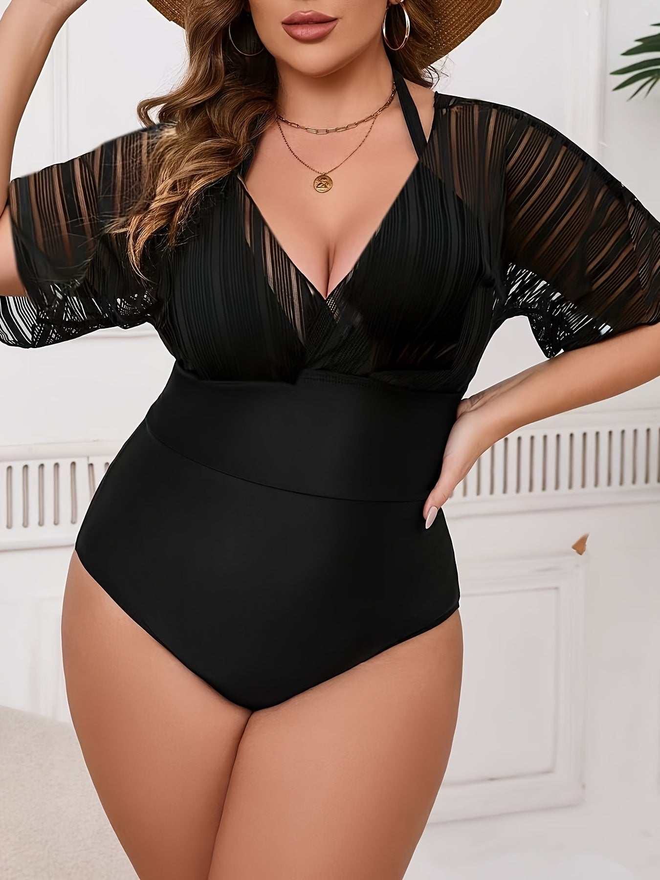 Stylish plus size women's one-piece swimsuit with matching cover-up. Features V-neck, high stretch, removable pads, machine washable.